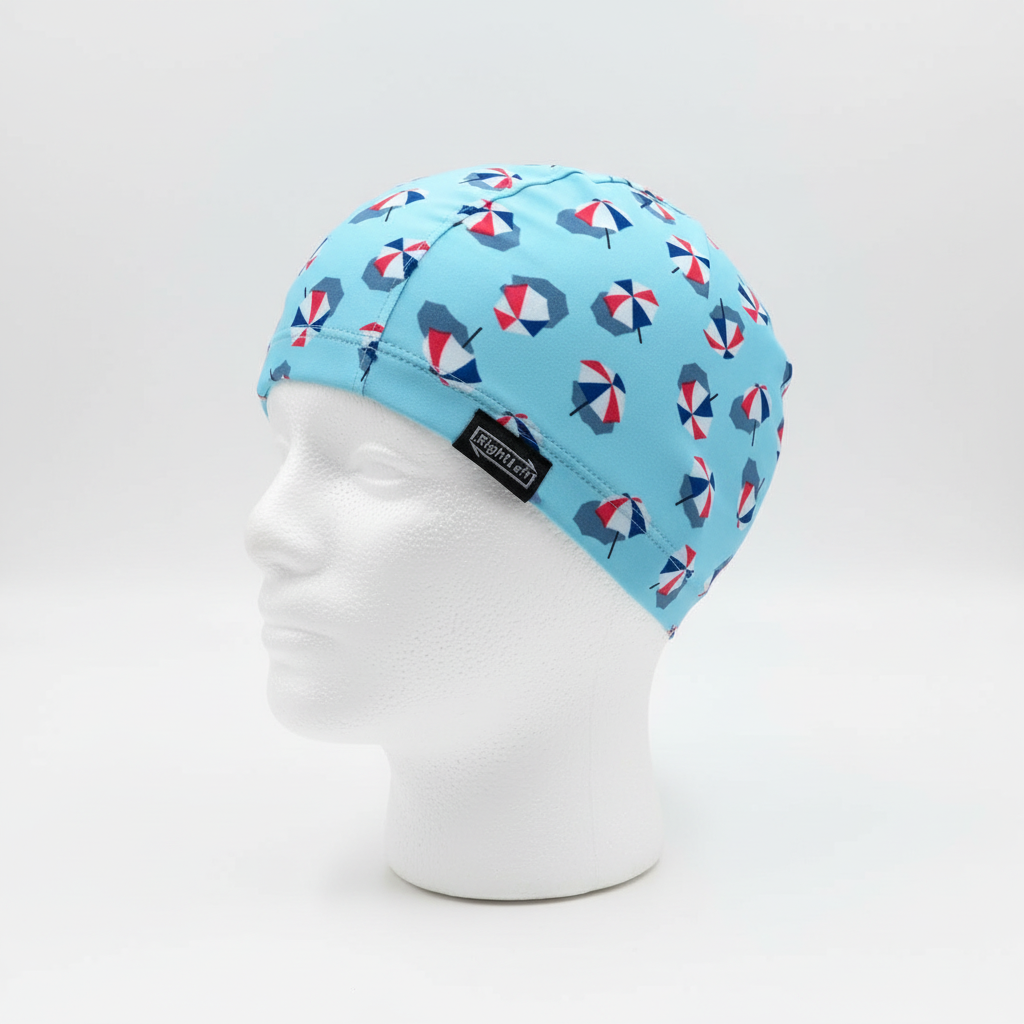 Beach umbrella patterned lycra cap on mannequin - left side view with brand