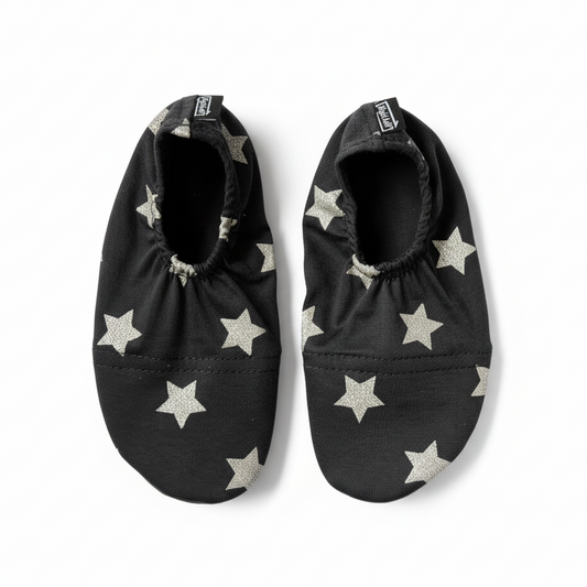 Black shoes with white stars on white background
