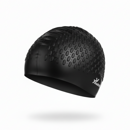 Black silicone swimming cap floating left side view with brand