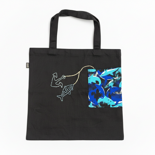 Black tote bag with fish design on white background