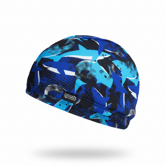 Blue shark patterned lycra cap - left side floating view with brand name