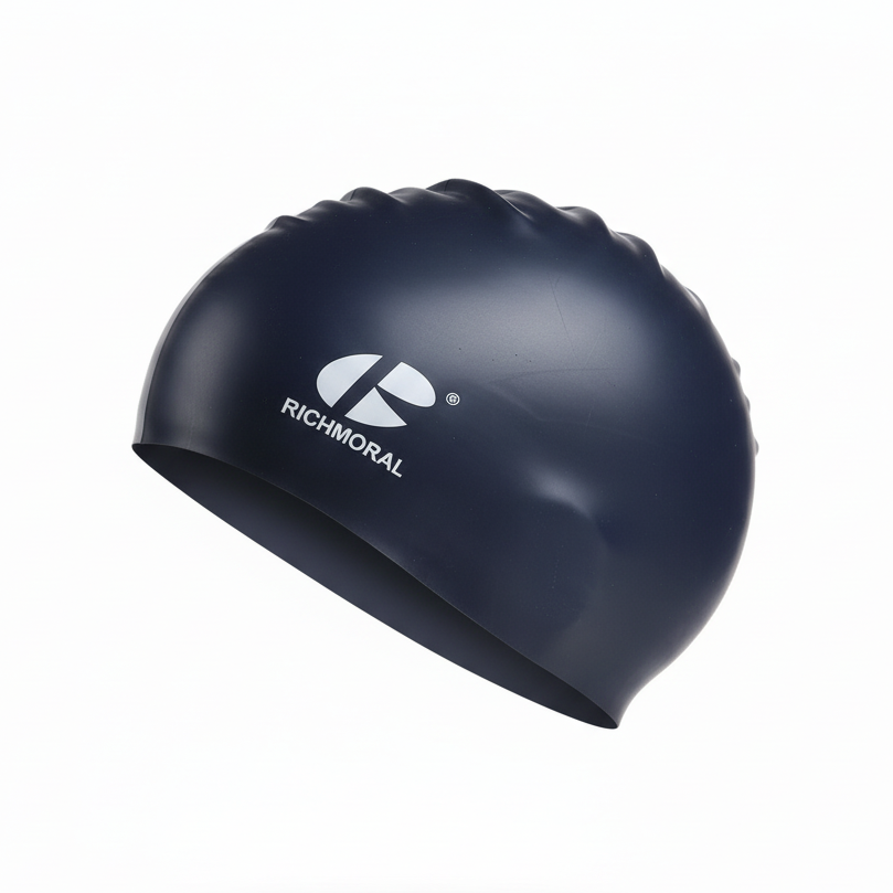 Dark blue RICHMORAL swim cap floating - left side view