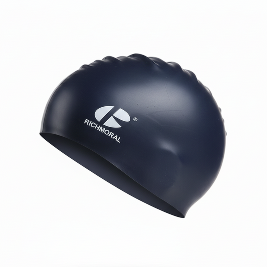 Dark blue RICHMORAL swim cap floating - left side view