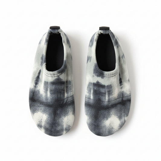 Gray and white tie-dye shoes on white background