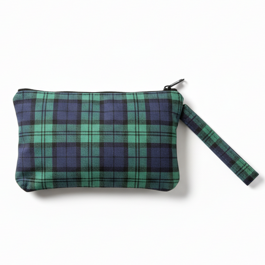 Green and purple plaid wristlet clutch on white background