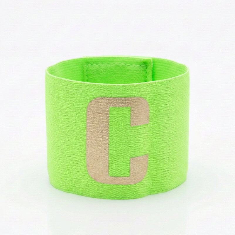 Lighter neon green captain’s armband with a light gold C