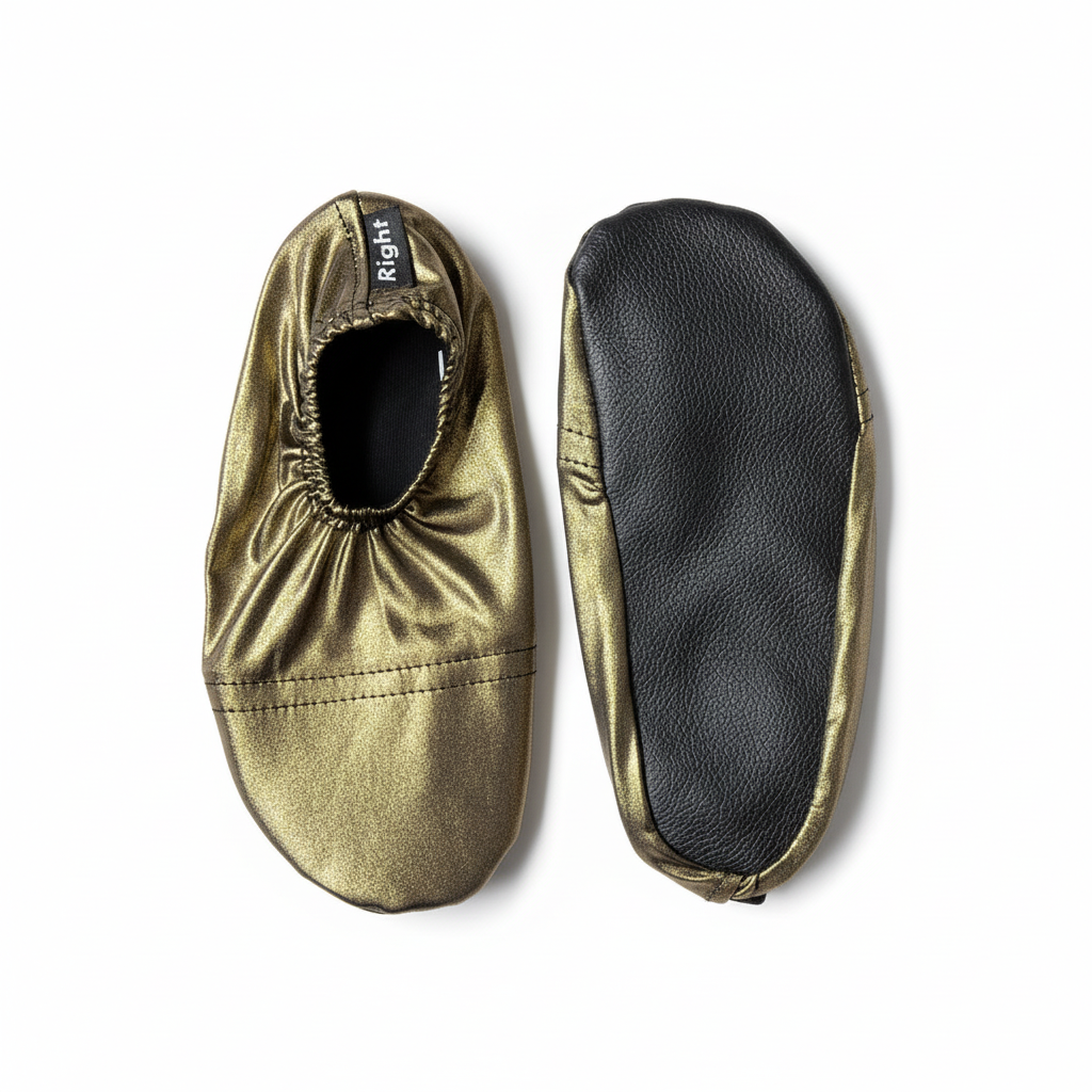 Metallic gold shoes with sole view on white background