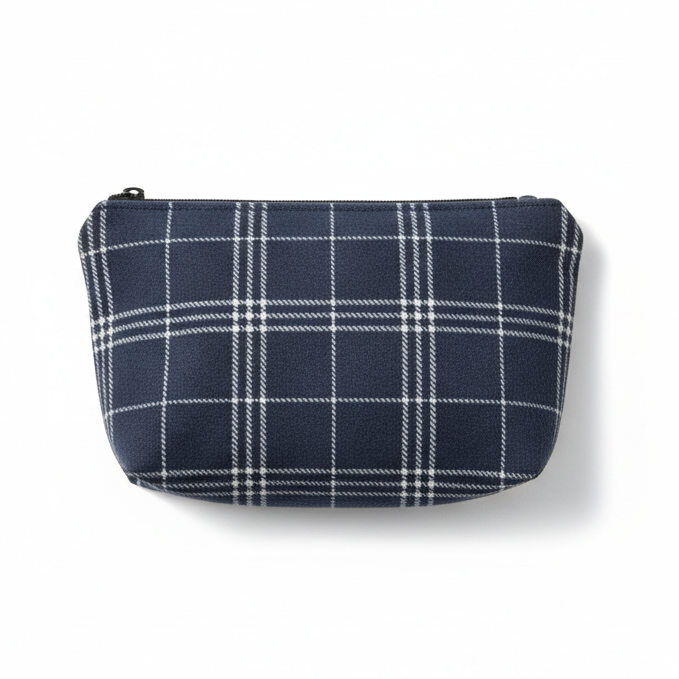 Navy blue and white plaid clutch pouch on white background
