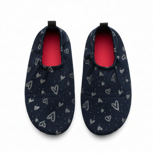 Navy shoes with silver hearts on white background