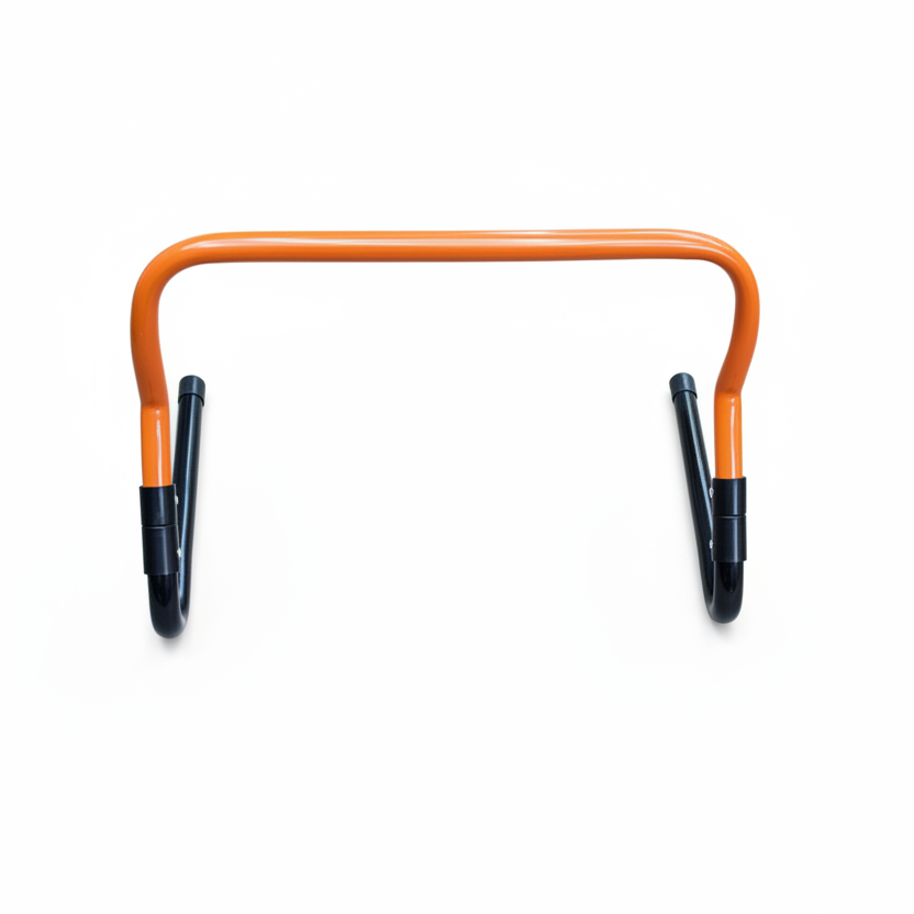 Orange agility hurdle with black feet white background