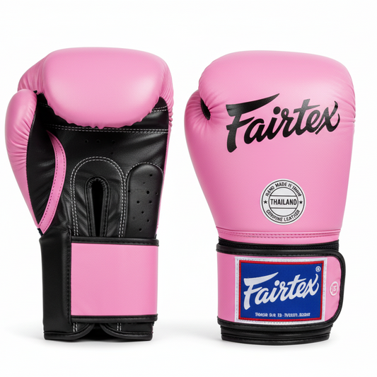 Pink Fairtex boxing gloves on white background