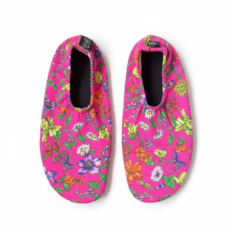 Pink floral shoes on white background