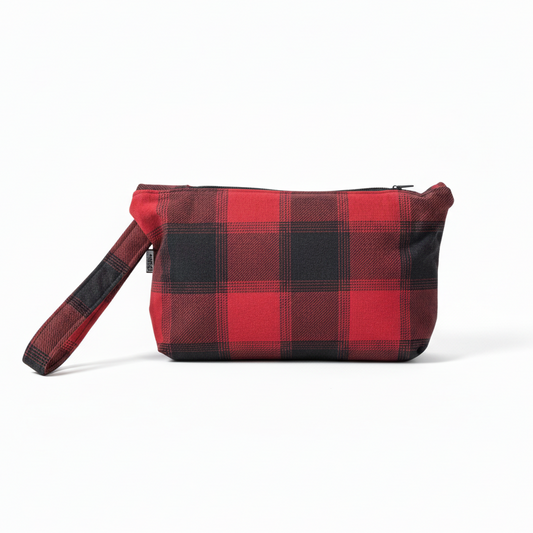 Red and charcoal gray buffalo plaid wristlet clutch on white background