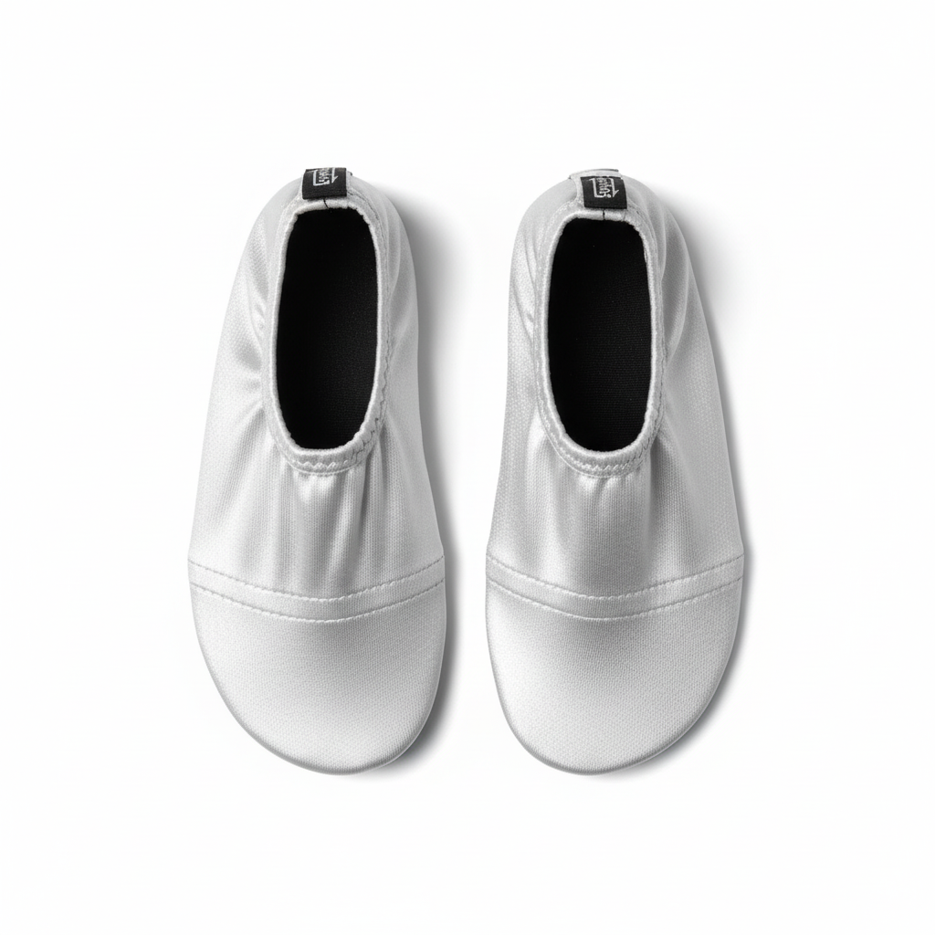 Silver metallic water shoes on white background