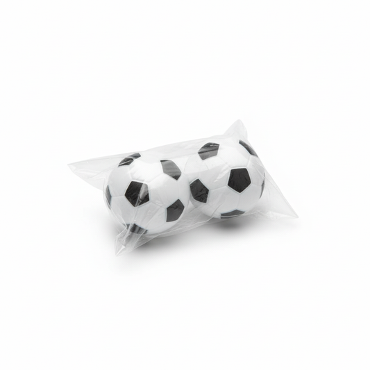 Soccer ball stress balls in packaging on white background