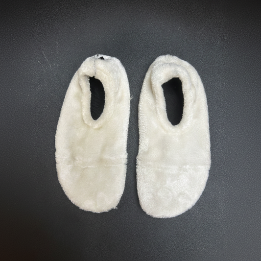 Square product image of white furry slippers