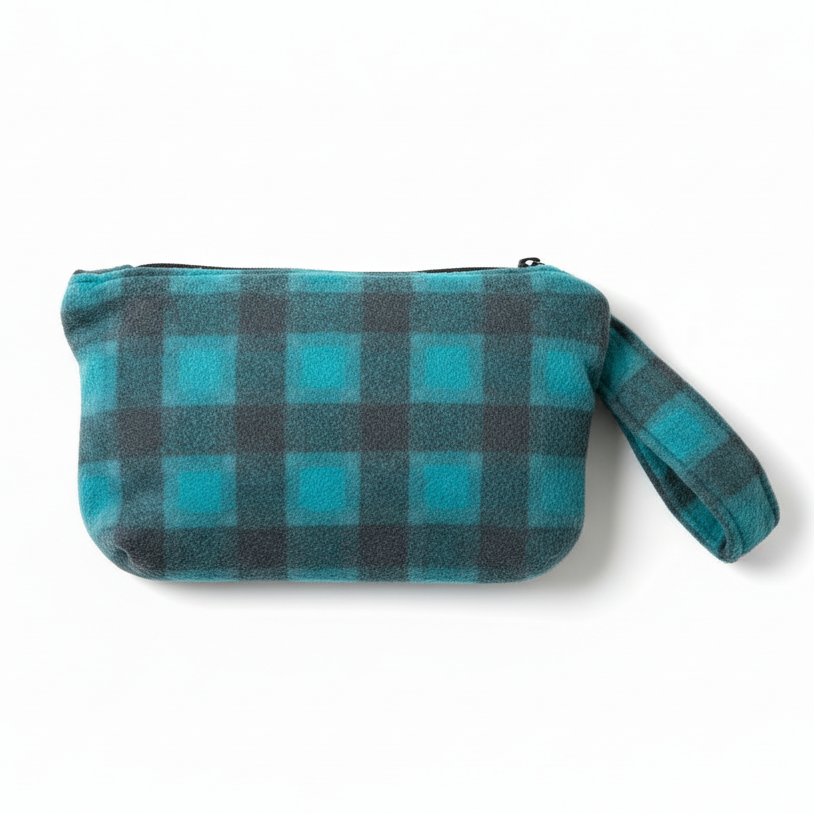 Turquoise blue and gray buffalo plaid fuzzy wristlet clutch on white background