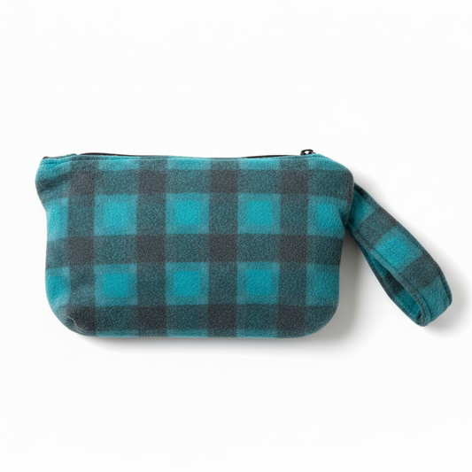 Turquoise blue and gray buffalo plaid fuzzy wristlet clutch on white background