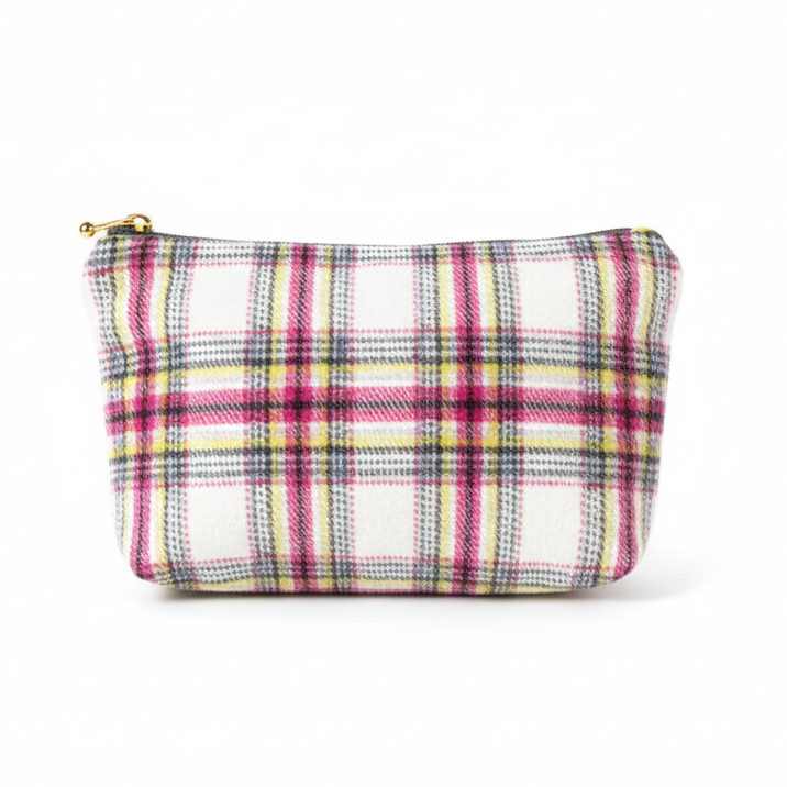 White, pink, and yellow plaid clutch pouch on white background