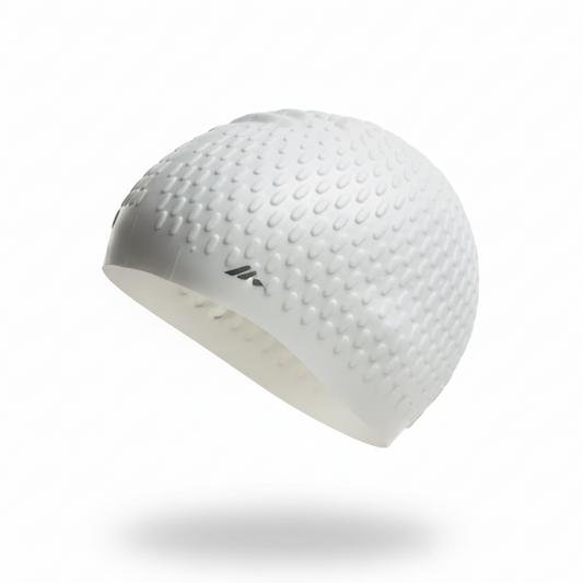 White silicone swimming cap floating left side view with Rightleft brand